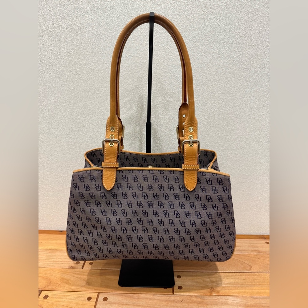Dooney and Bourke signature monogram Canvas and leather buckle satchel bag